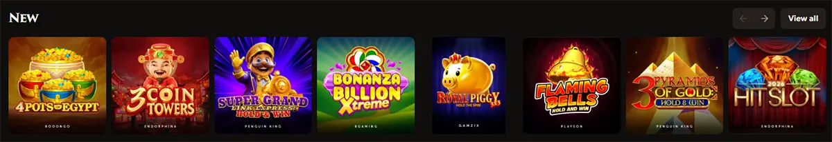 New slot games section featuring 4 Pots of Egypt, 3 Coin Towers, Super Grand Express Hold & Win, Bonanza Billion Xtreme, Royal Piggy, Flaming Bells Hold and Win, 3 Pyramids of Gold, and Hit Slot, with navigation arrows and a “View all” button on a dark casino interface.